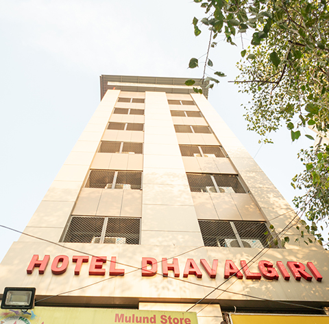 Hotel Dhavalgiri building facade with red signage