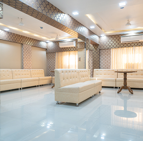Bright lounge with cream tufted sofas
